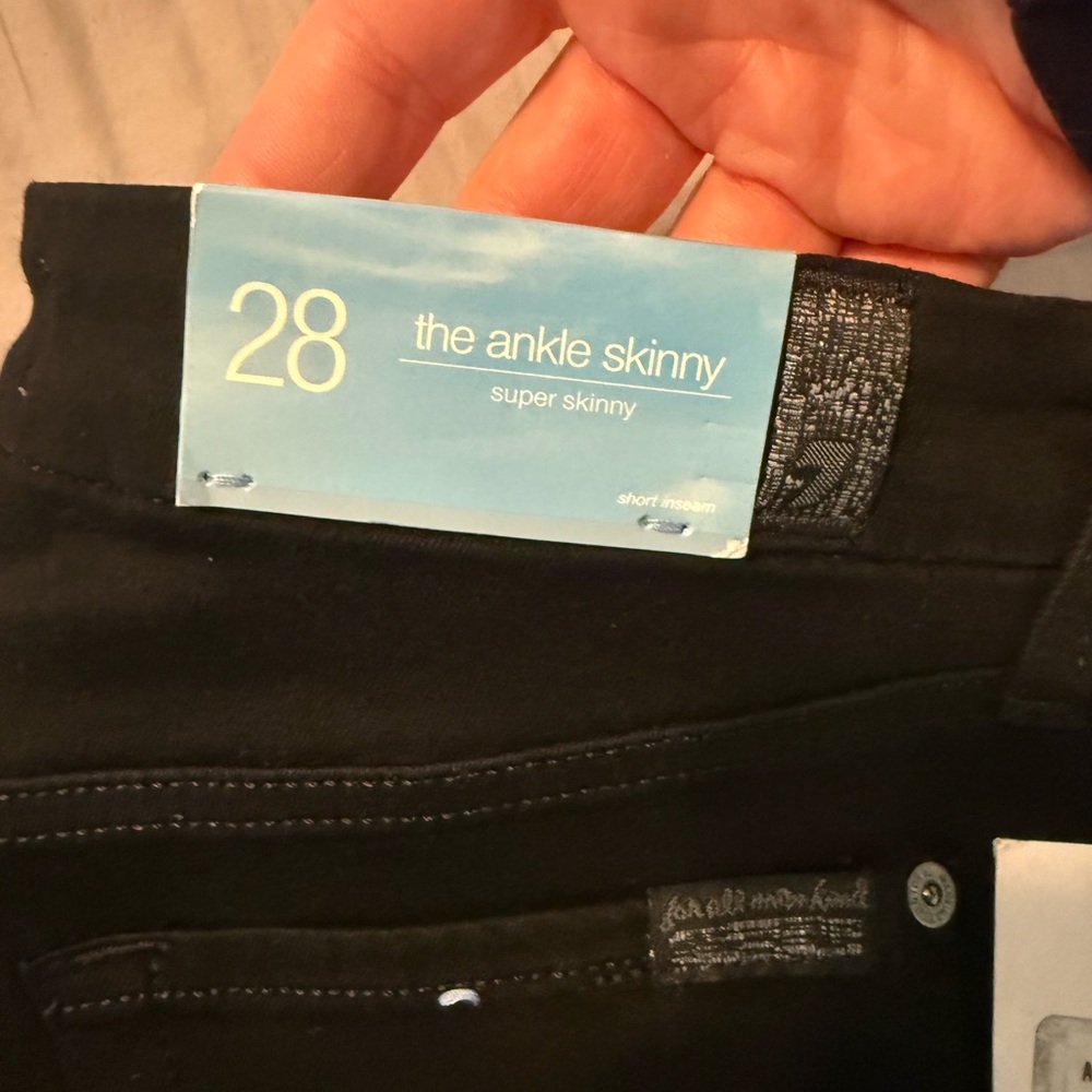 The Ankle Skinny Super Skinny Black Jeans with cuts in the knee